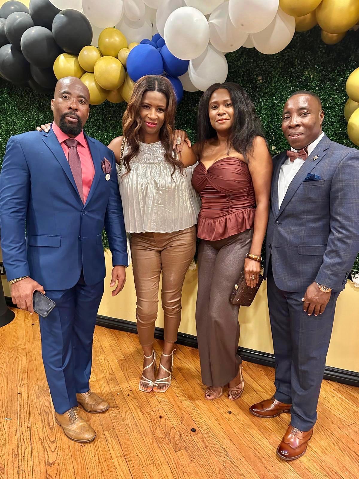 A group of people in formal suits and dress